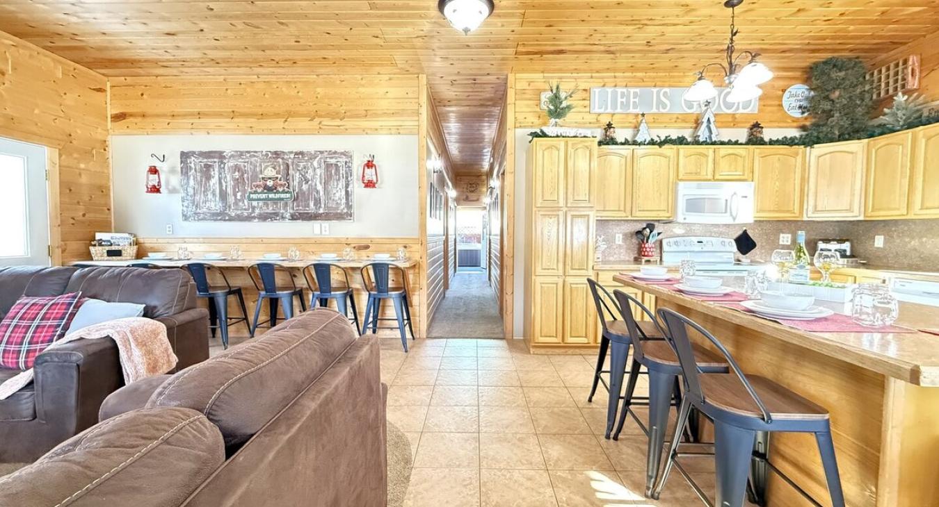 View from the entryway highlighting the open concept of kitchen and living area.