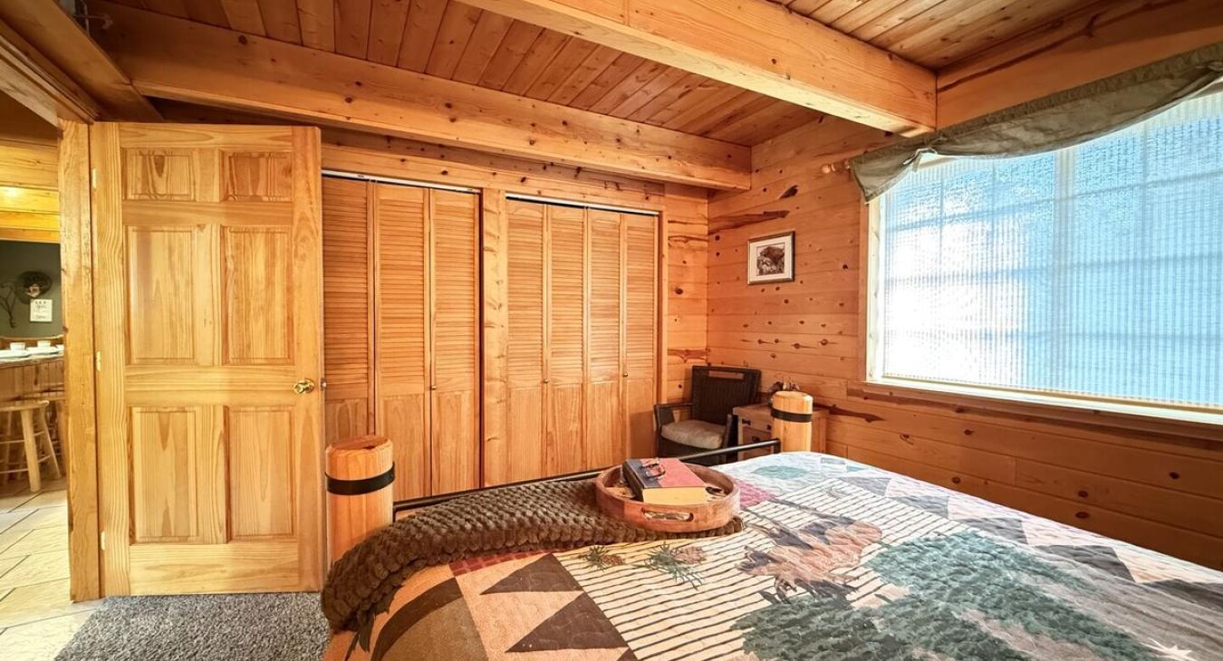 Bedroom #1 located on the main level with a Queen size bed.
