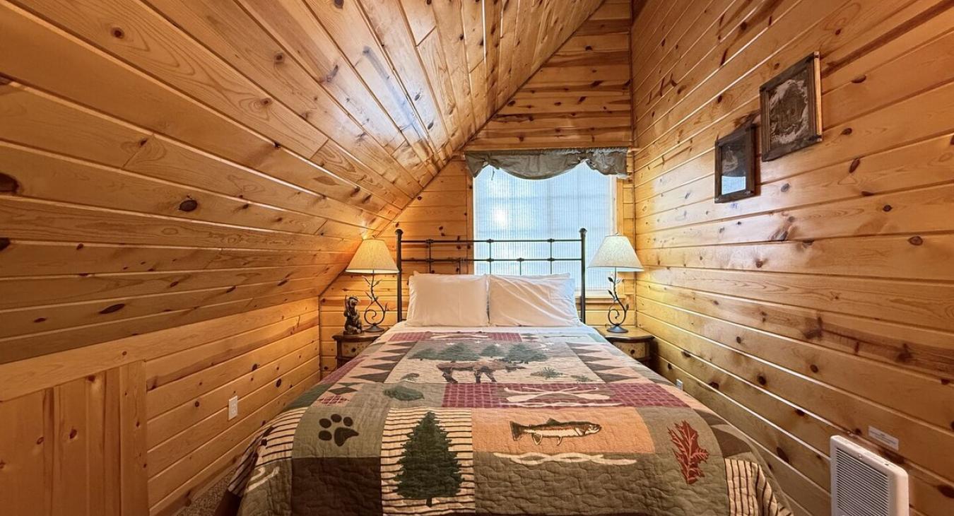 Bedroom #2 located upstairs with a Queen size bed.