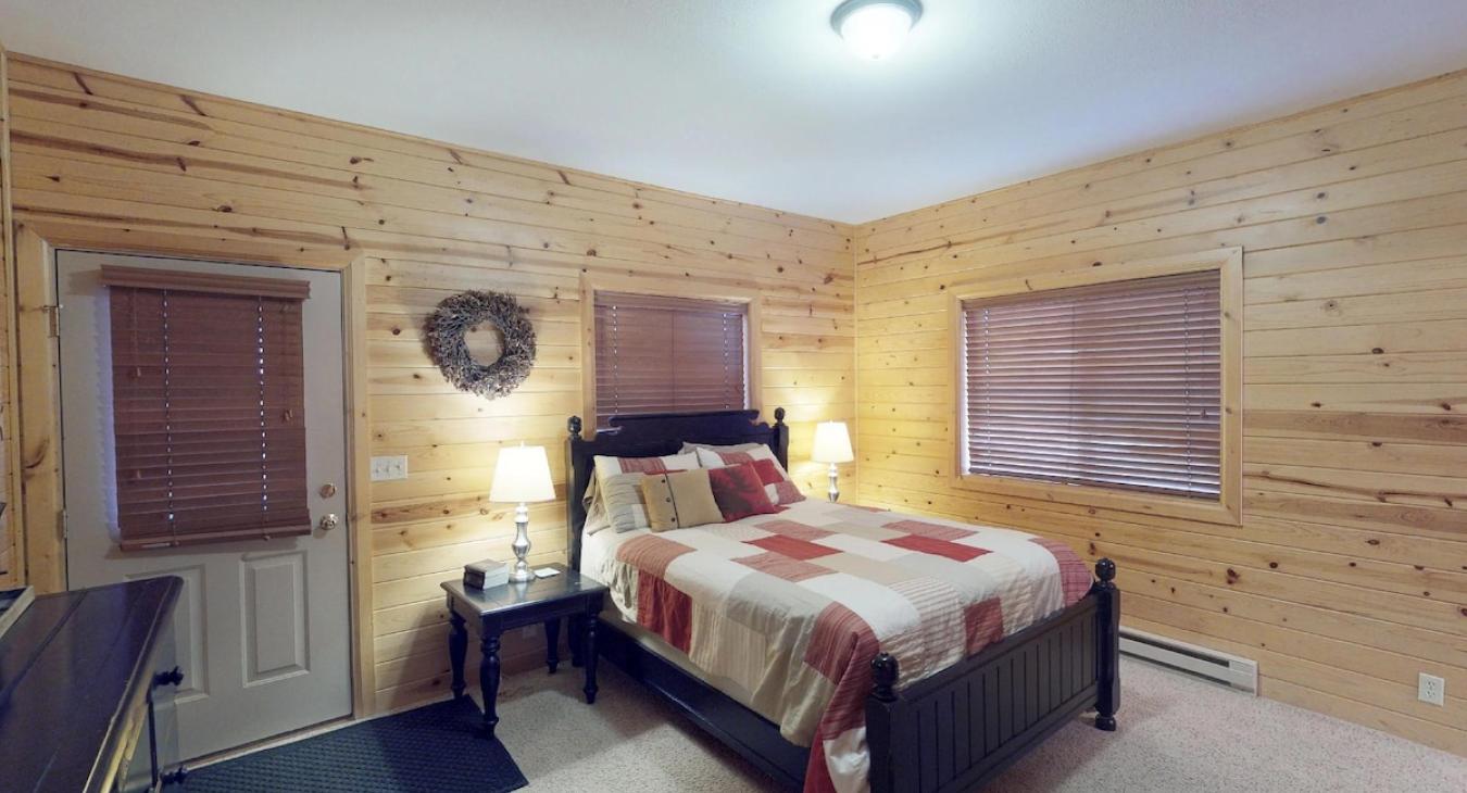 The master bedroom is so cozy with a queen bed and a ensuite bathroom.