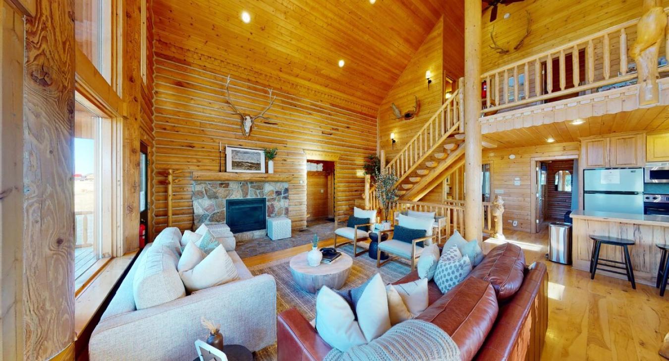 Lots of seating in the living area along with a fireplace.