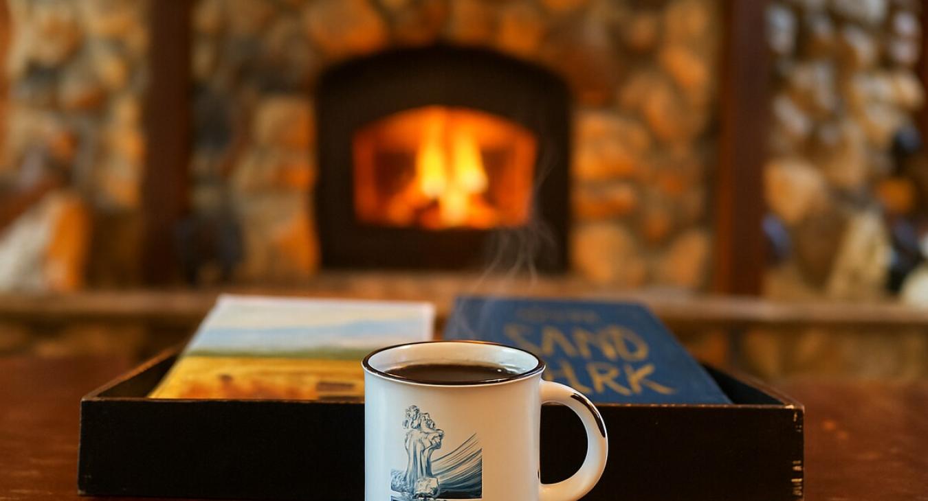 Enjoy a hot cup of coffee in front of the wood fireplace.