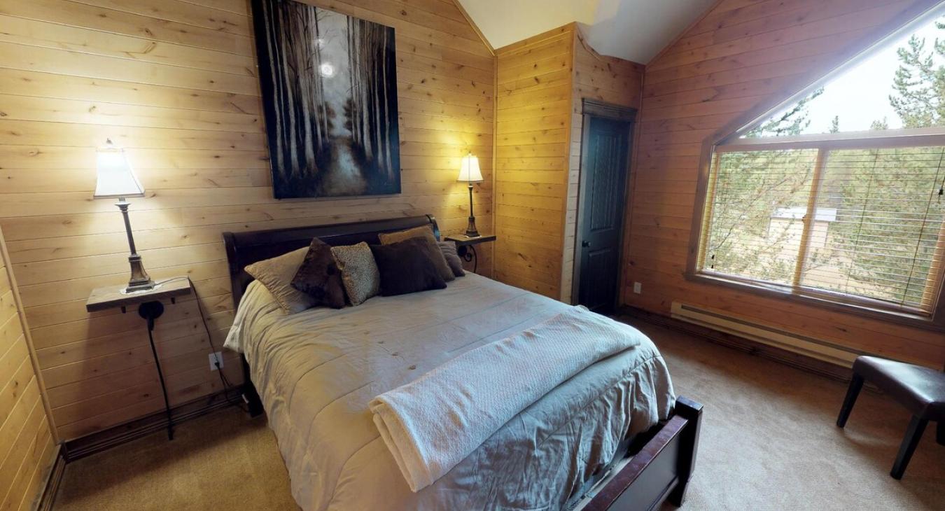 Bedroom #4 located upstairs with a Queen size bed in the room.