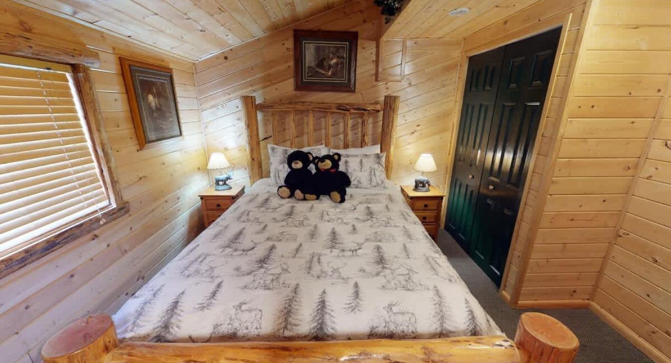 Bedroom #1 located on the main floor with a Queen size bed.