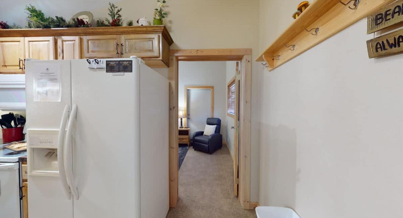 Located to the right of the kitchen is the second bedroom.
