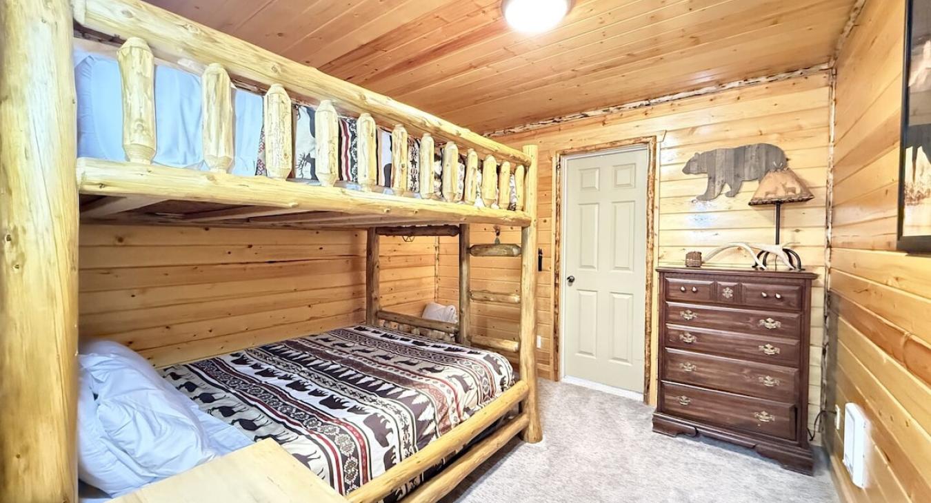 Bedroom #1 with a bunk bed with 2 queen size beds.