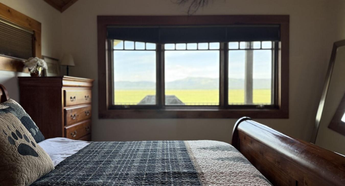 Master bedroom with stunning meadow views.