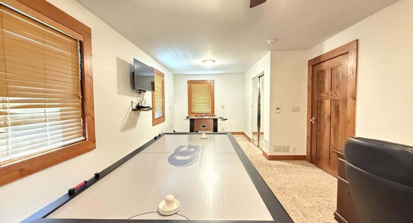 Game room with Air Hockey and Foosball table.