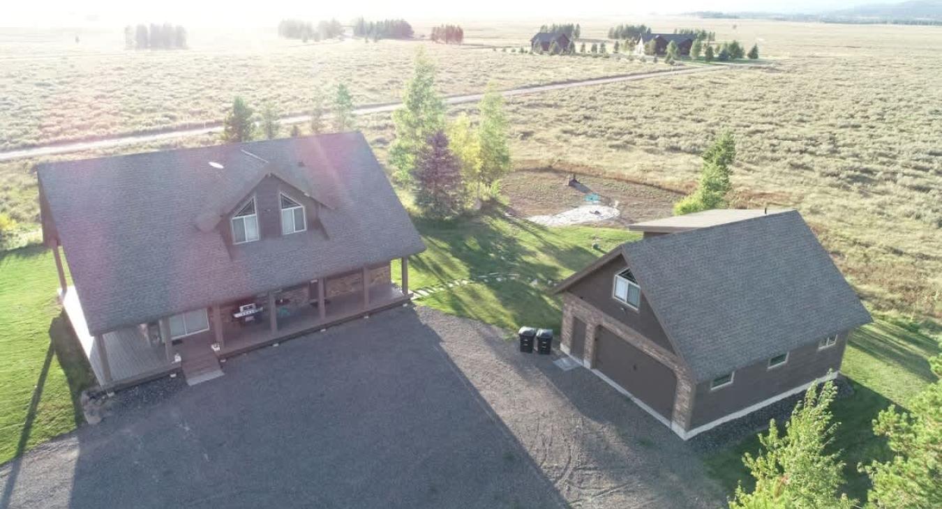 Whether it's the peaceful morning mist over the water, the golden sunset light spilling through the trees, or the soft snowfall in the winter, the view from a modern cabin in this area would offer a perfect blend of natural beauty and modern comfort.