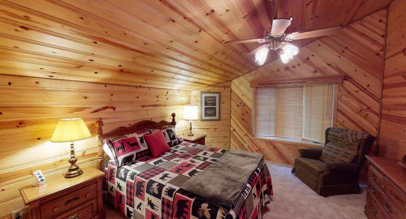 Main level bedroom #1 with a Queen size bed.