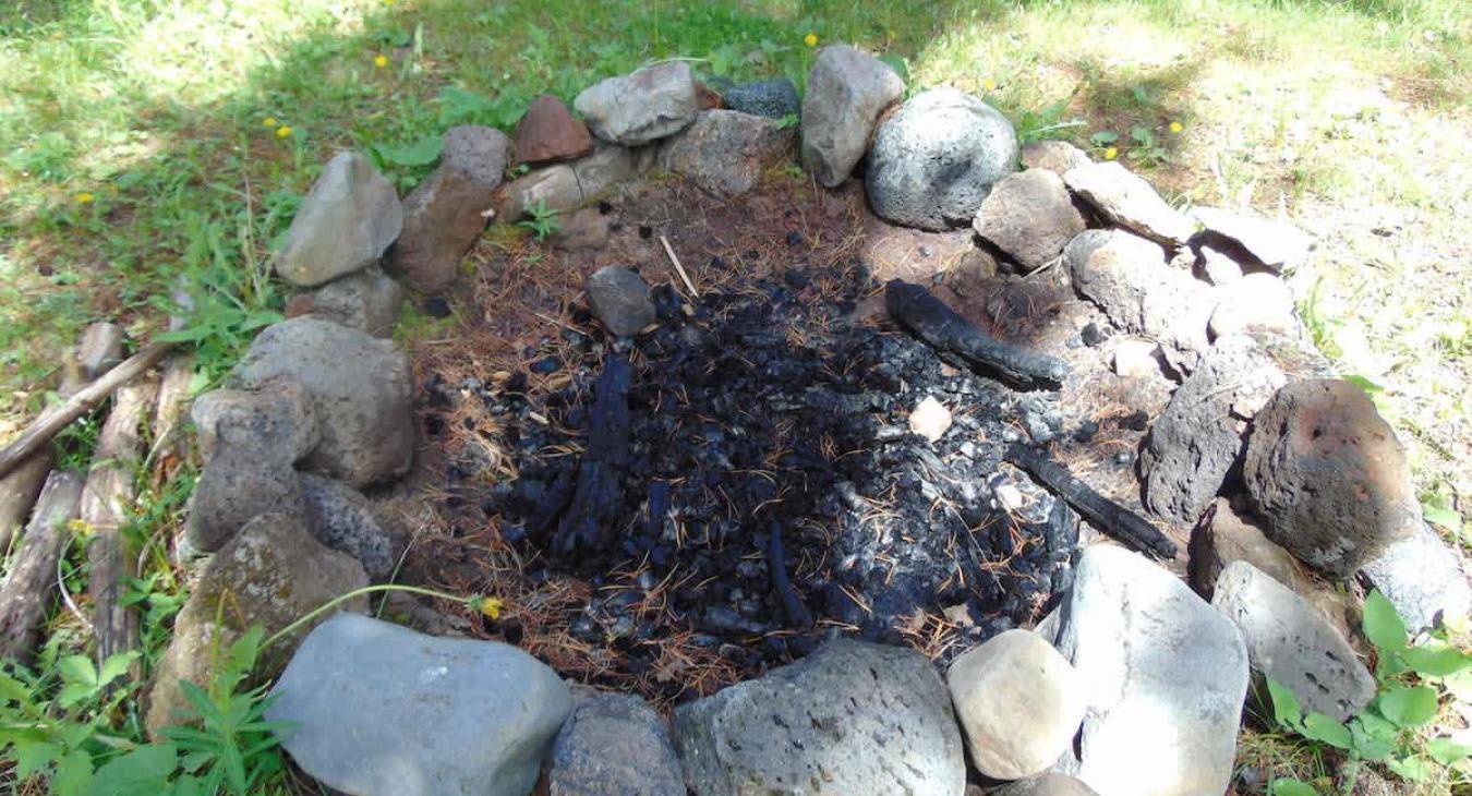 Fire pit located outside for your use.