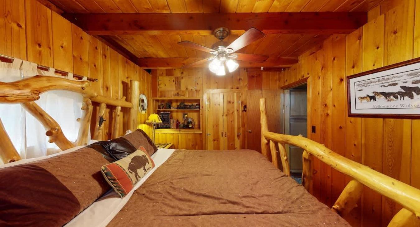 Beautiful bedroom with wood paneling.