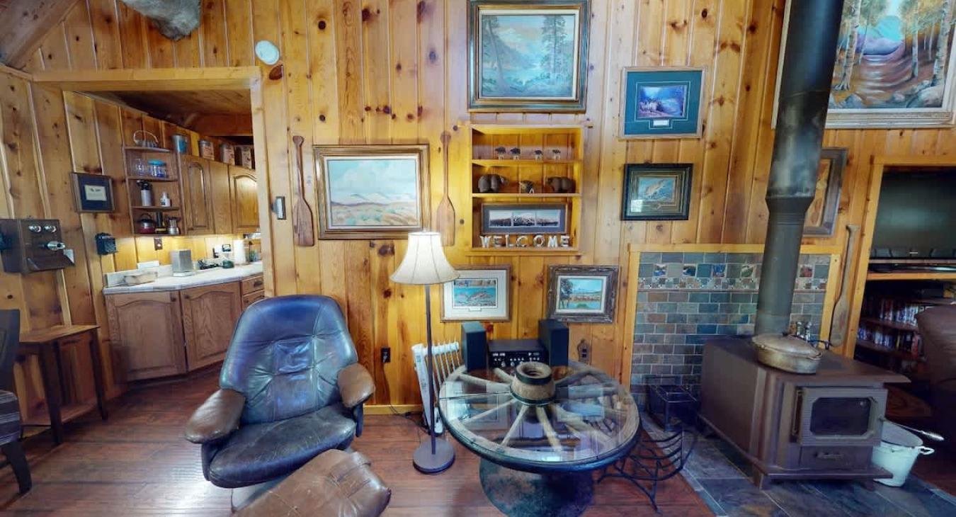 Living room area with chairs and decor.