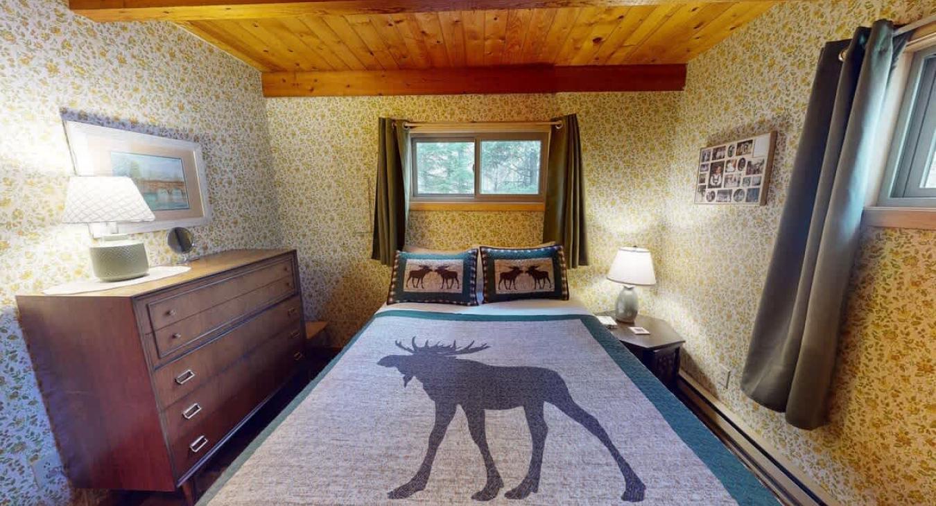 The master bedroom is located on the main level with a queen size bed.