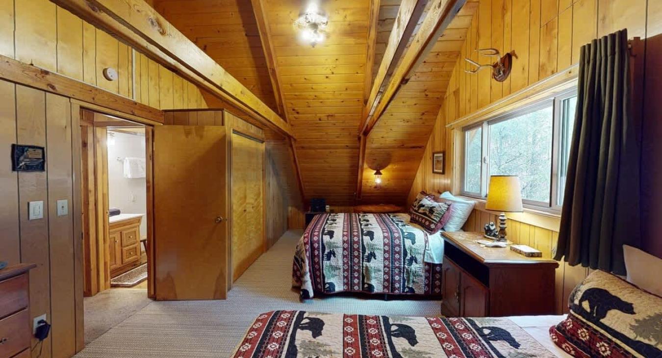 The second bedroom upstairs is equipped with one double bed and one twin bed.