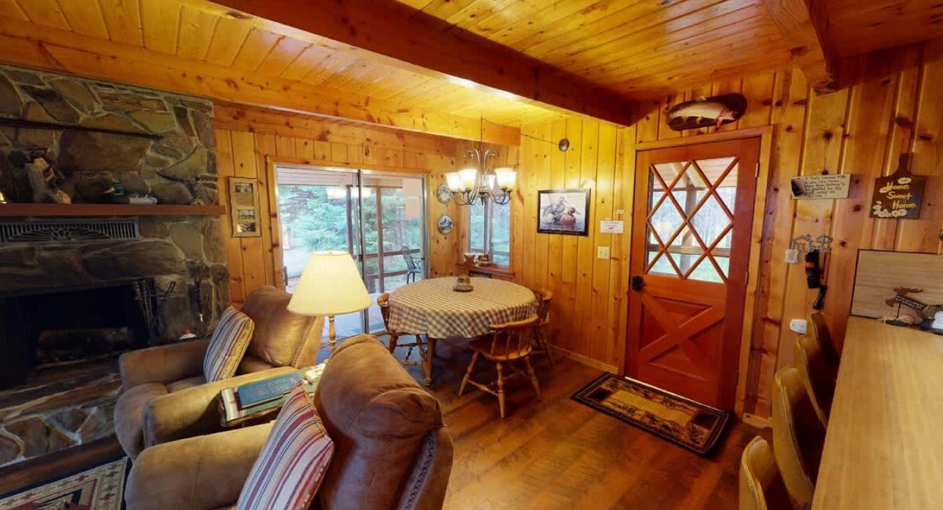 The entry to the cabin welcomes you the living room.