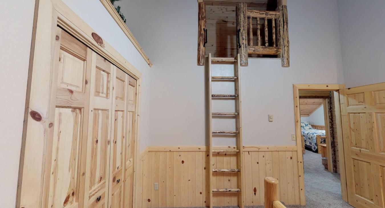Ladder to access the small loft area in this room.