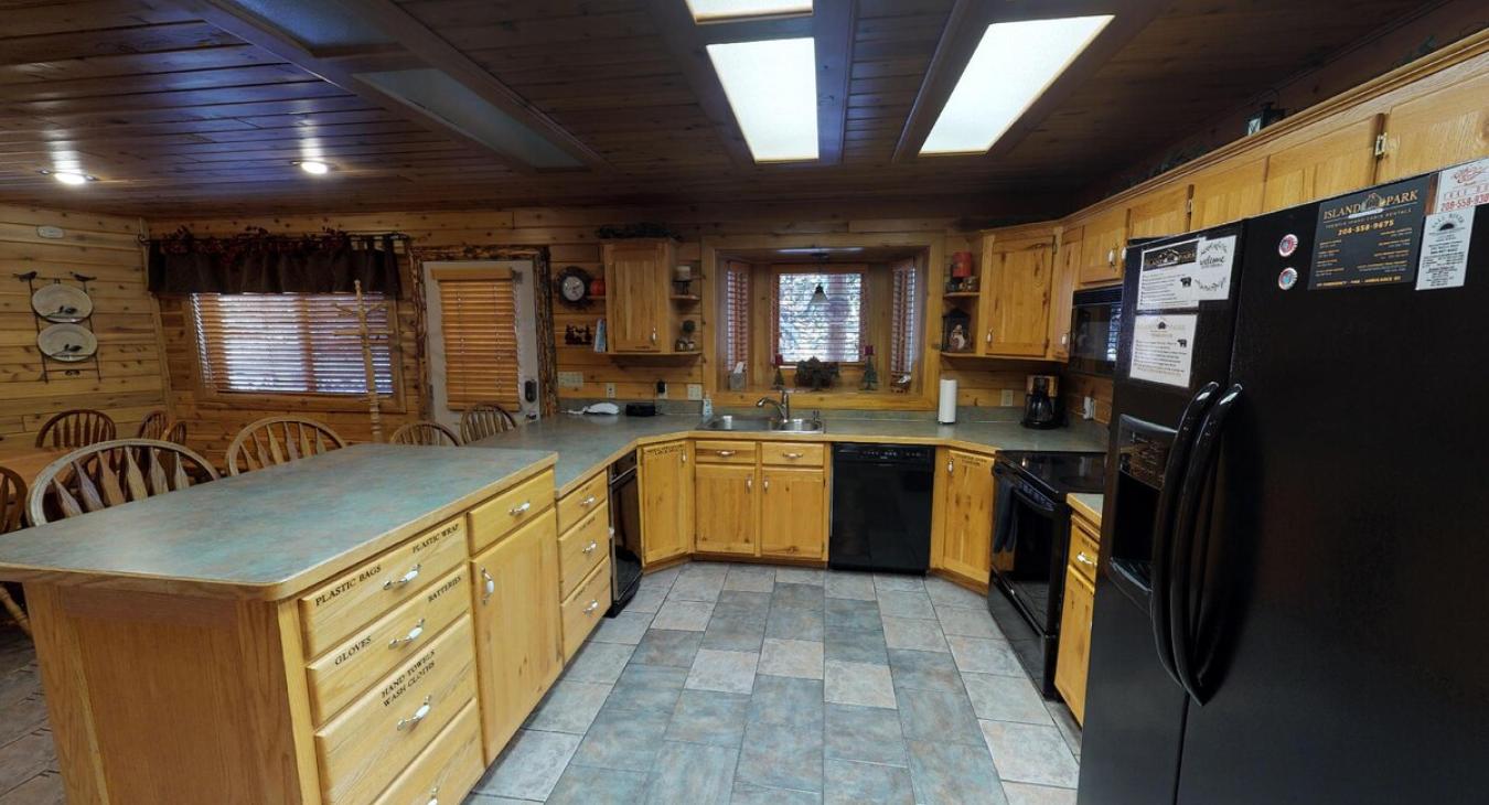 Kitchen comes equipped with a fridge, oven, microwave, and a dishwasher. It is also equipped with dishes, silverware, and basic cooking essentials.
