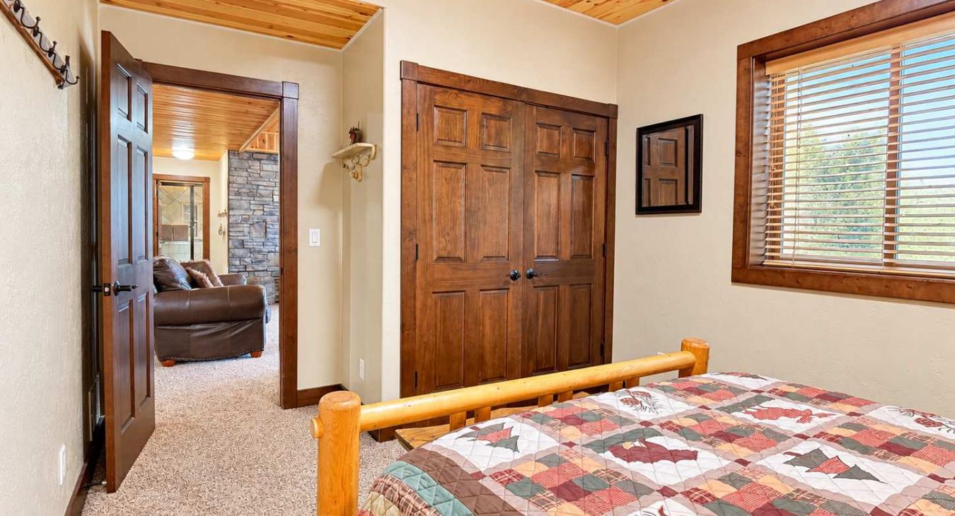 Basement Bedroom #1 downstairs with a Queen size bed.
