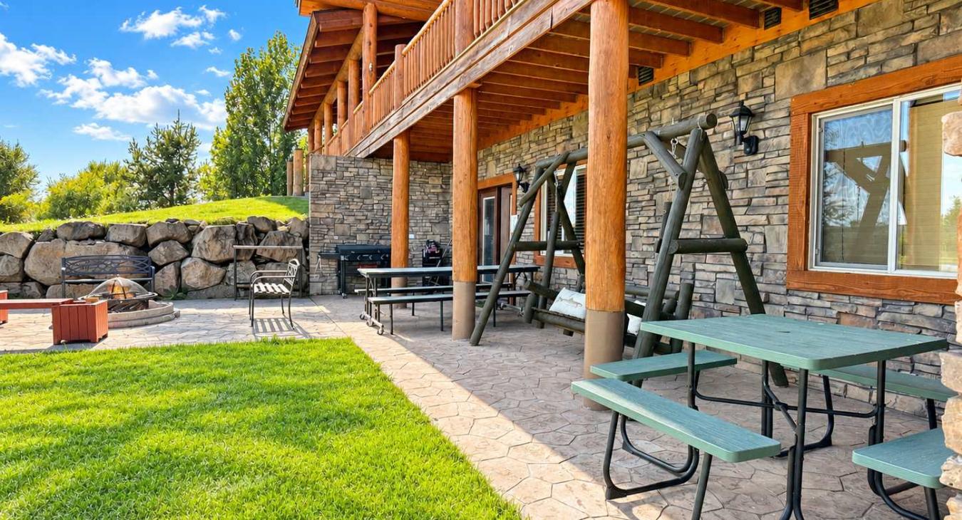 Picnic table, swing and fire pit located right out the basement doors.