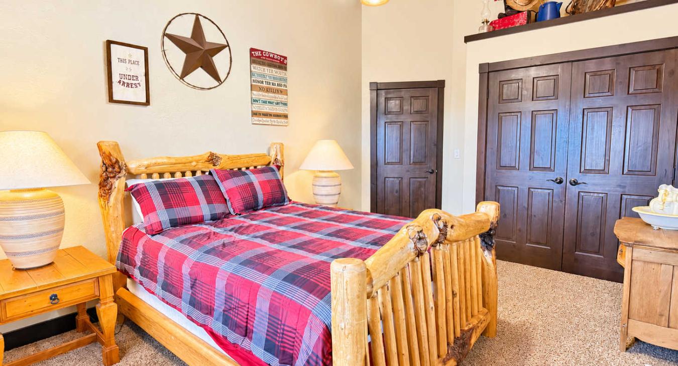Bedroom 3 located upstairs with a Queen size bed.