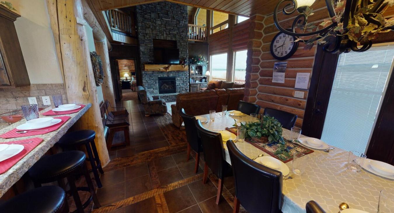 Seating is available at the dining table and the kitchen island for everyone to enjoy their meals.