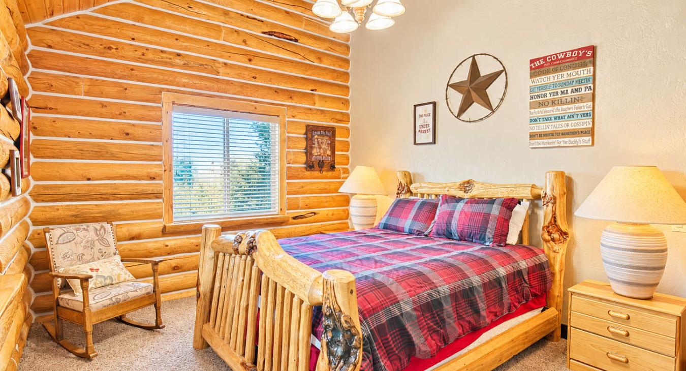 Private bedroom upstairs with a queen size bed.