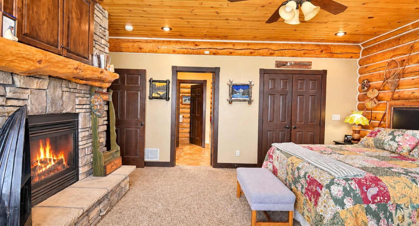 Master Bedroom with a private bathroom and king size bed. Private walk out patio.