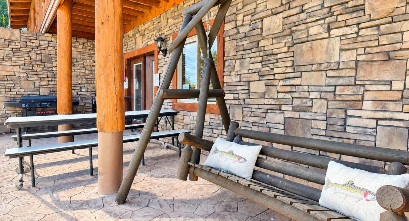 Sit back and relax on the swing while your family places on the large lawned back yard overlooking the water.