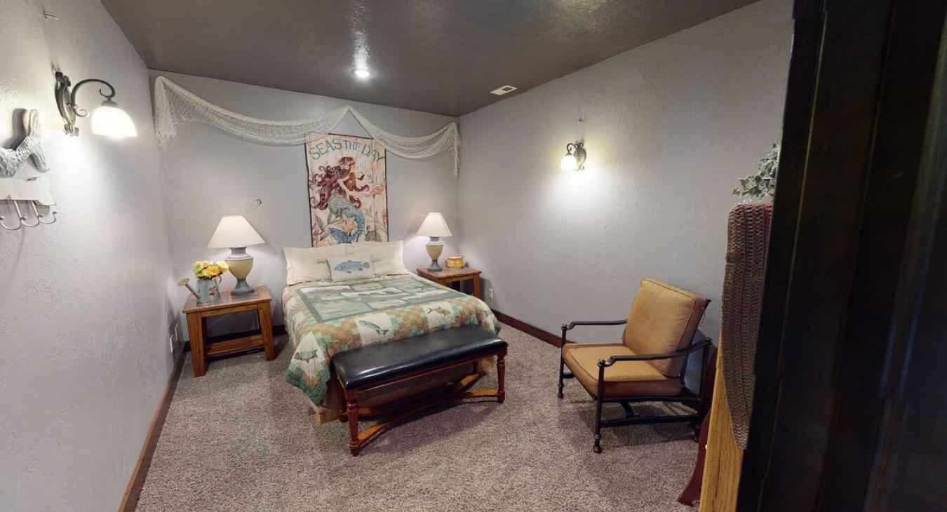 Bedroom #4 downstairs with a Queen size bed.