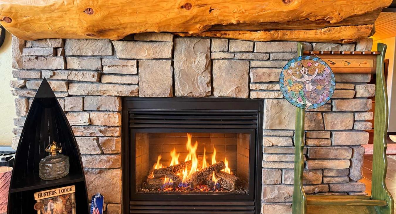 Master bedroom with a propane fireplace.