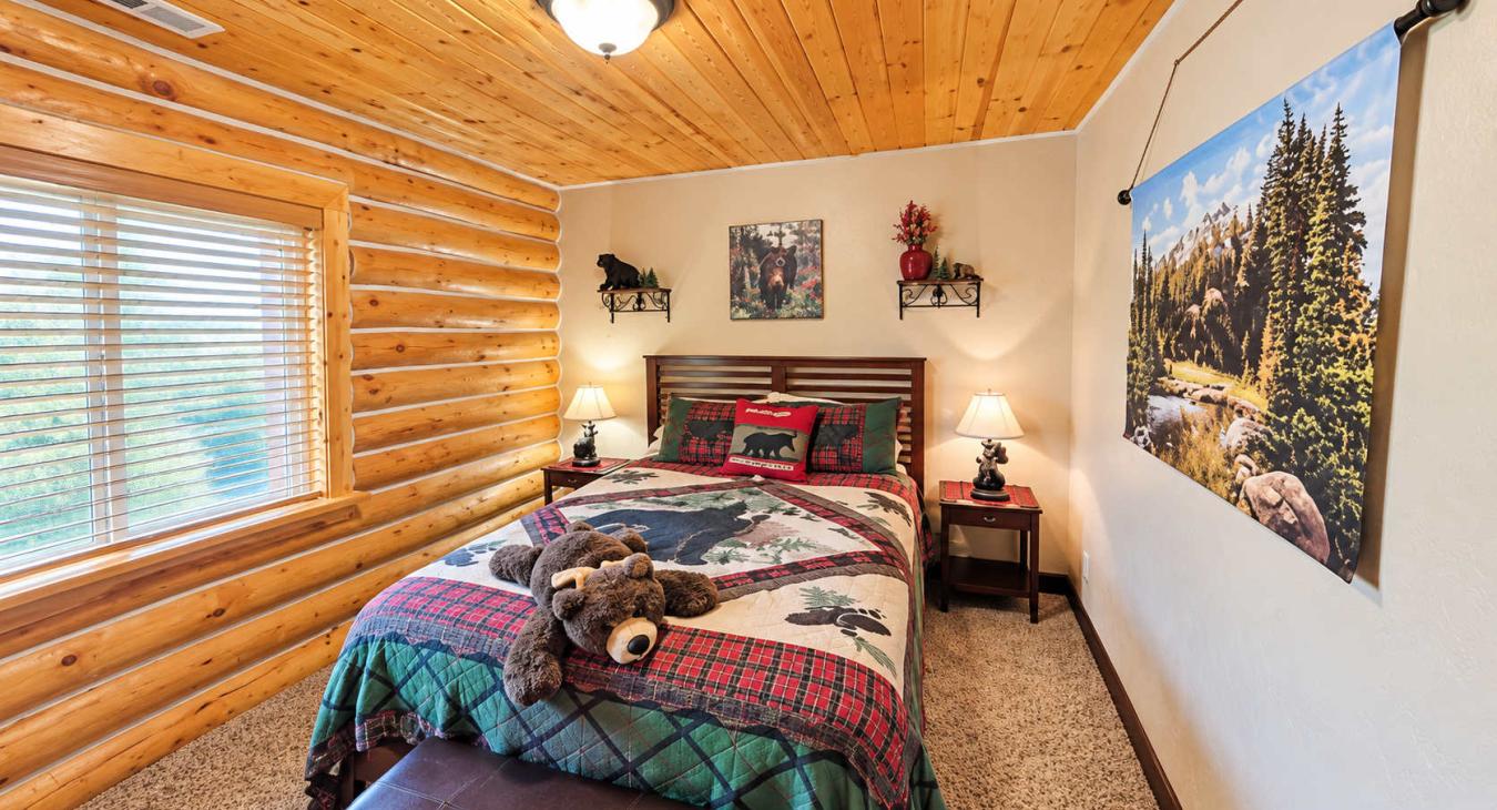 Bedroom 1 located upstairs with a Queen size bed.