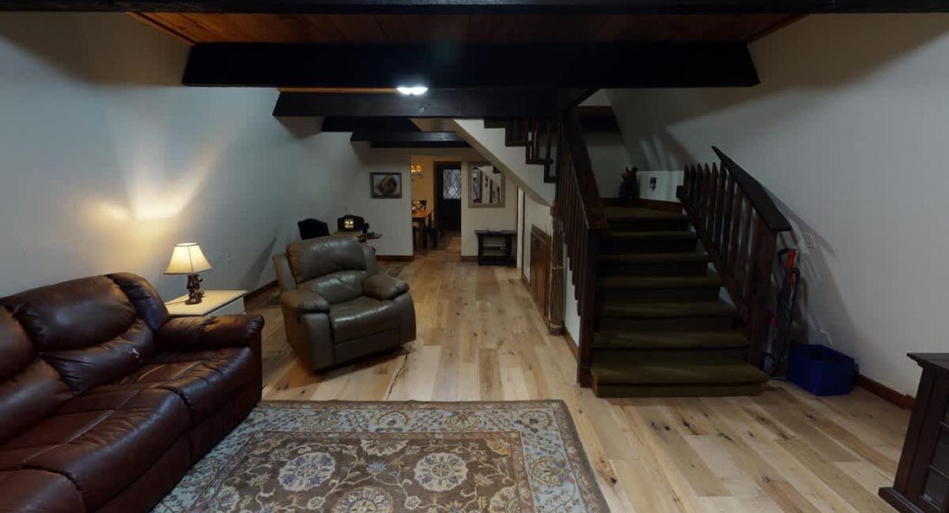 The living room has a full couch and tv.