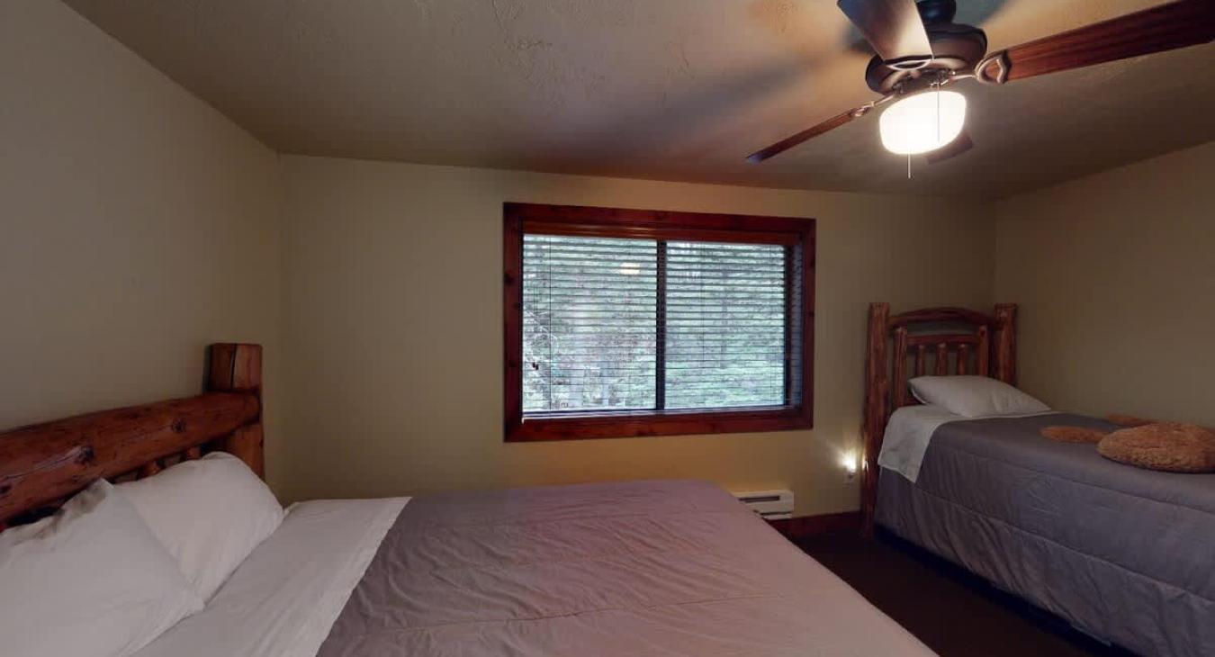 The second bedroom features a queen bed and a twin trundle bed. Perfect for up to 4 people.
