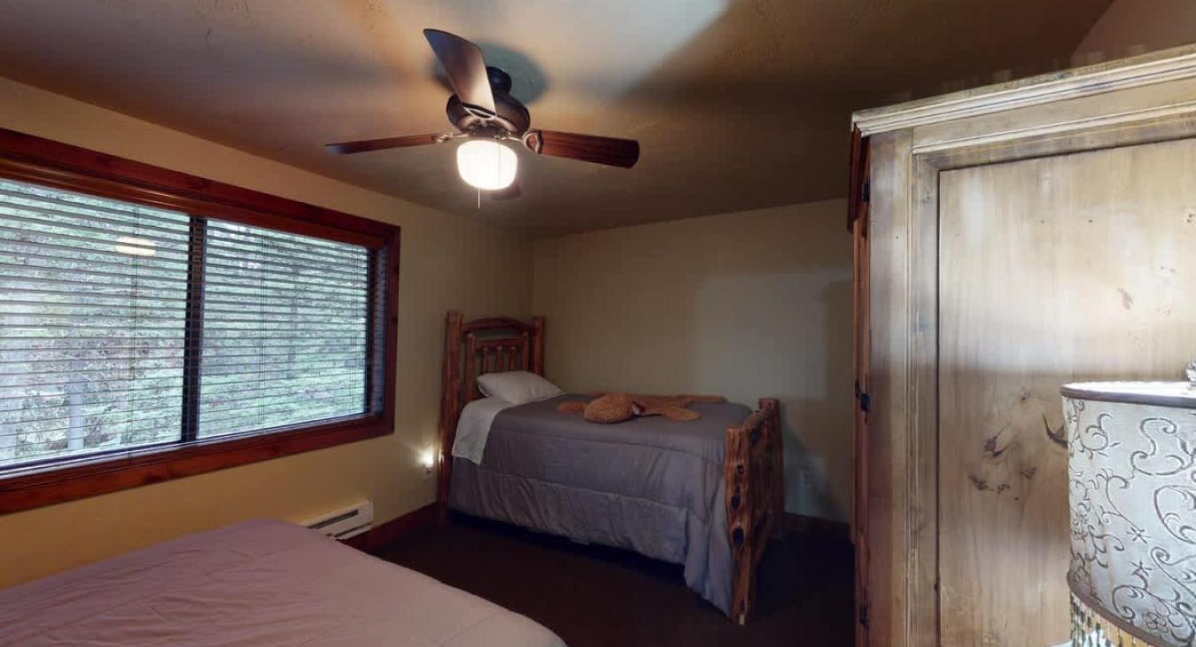 The second bedroom brings natural light to the room with the window.