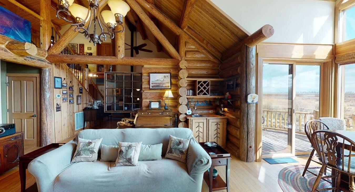 Natural light pours in through large windows, tying it all together with a view of the forest just beyond.