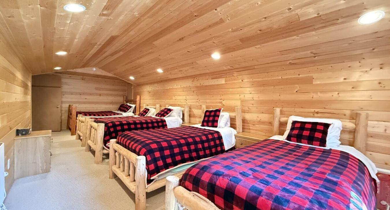 Kids bedroom with 3 twins and 1 full.