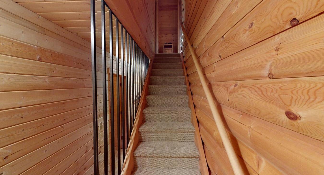 Stairway leading up to the upper bedrooms.