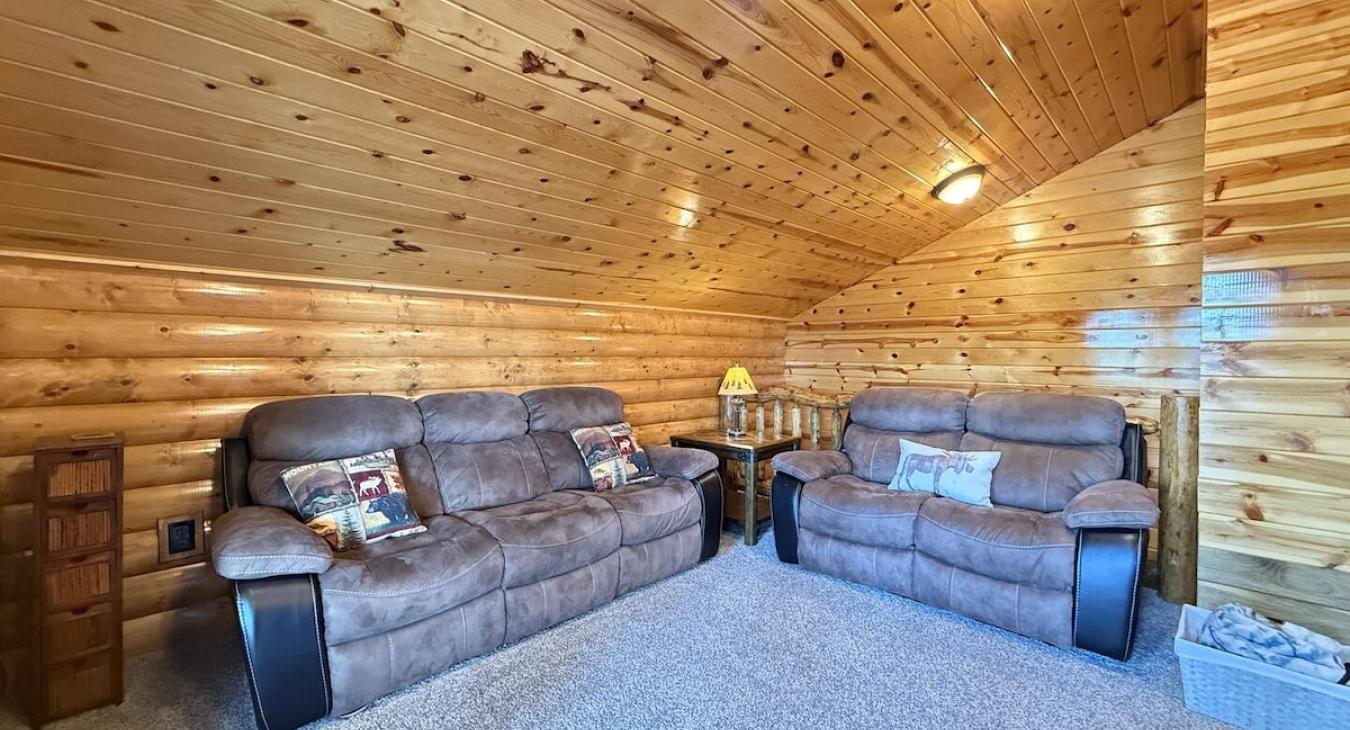 Additional seating in the loft with access to the deck here.