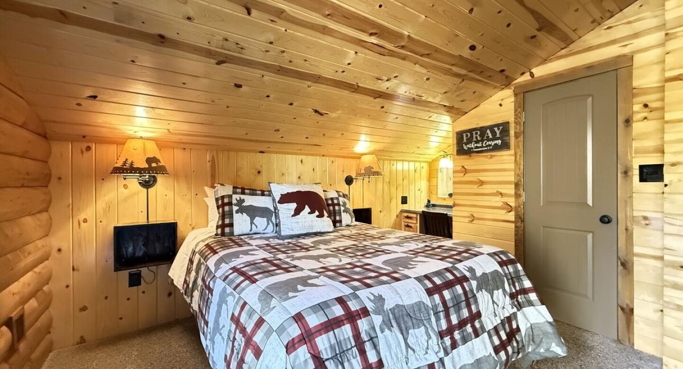 Bedroom #3 located upstairs with a Queen size bed. A closet is located in this room to store your belongings.