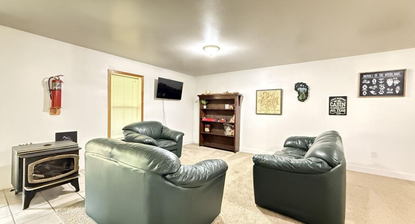 Spacious seating area with games and a tv.