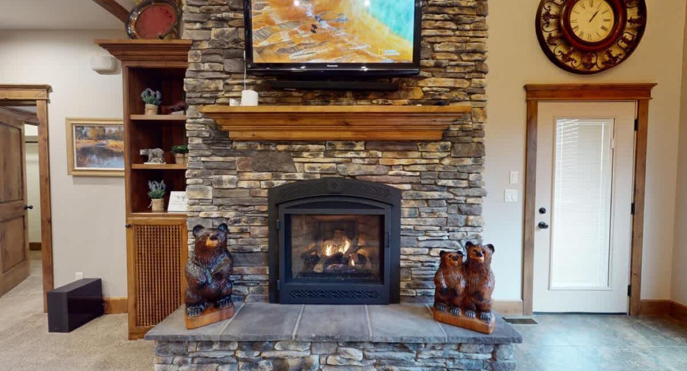 Cozy up by the wood burning fireplace after a long day outdoors.