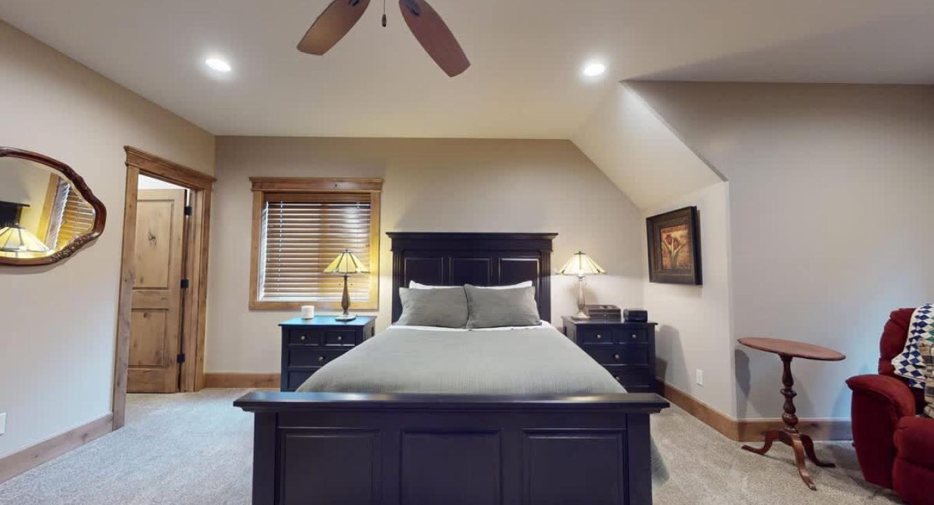 Upstairs master bedroom with a Queen size bed.