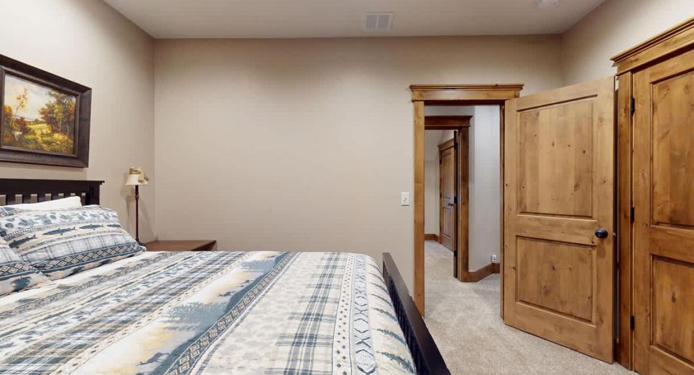 Bedroom #3 located upstairs with a Queen size bed.