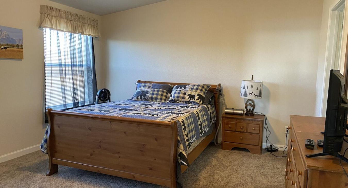 Master bedroom with a Queen size bed.