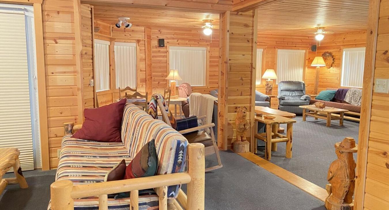Lots of seating and windows to bring a cozy atmosphere to the cabin.
