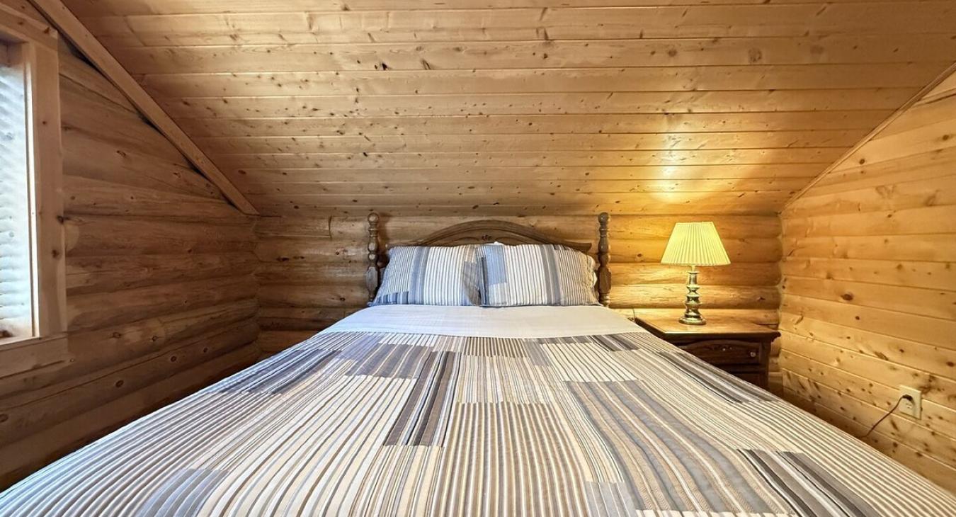 Bedroom #3 located upstairs with a Queen bed.