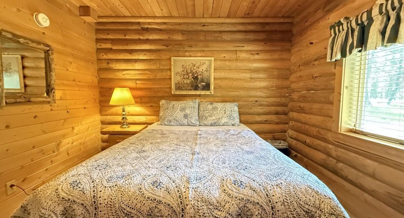 Bedroom #2 located on the main floor with a Queen size bed.
