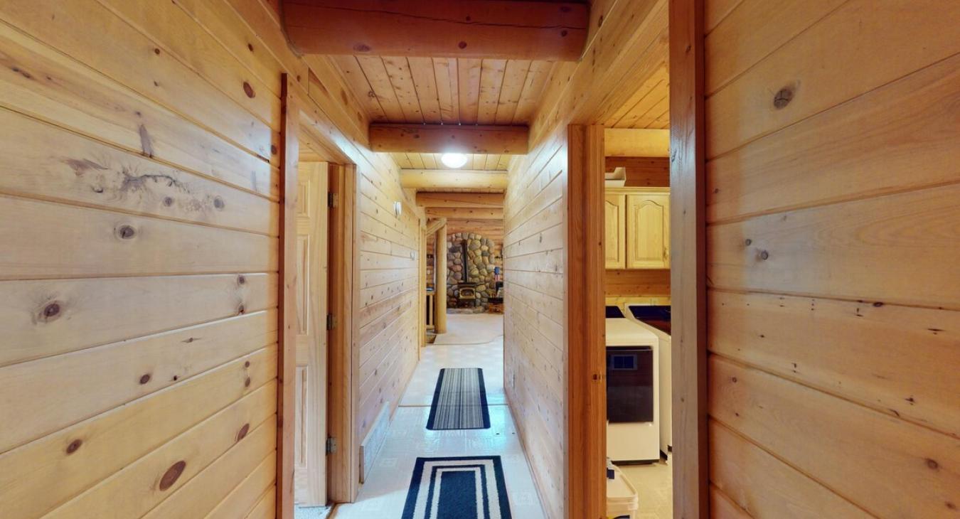 Entryway in the main level to access the laundry room and other bedrooms.