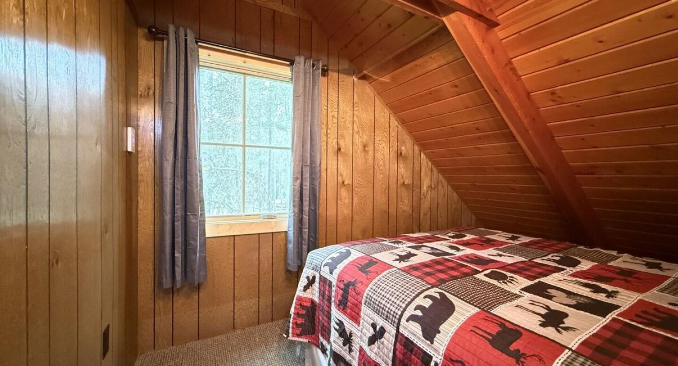 Bedroom #3 located upstairs with a queen size bed.